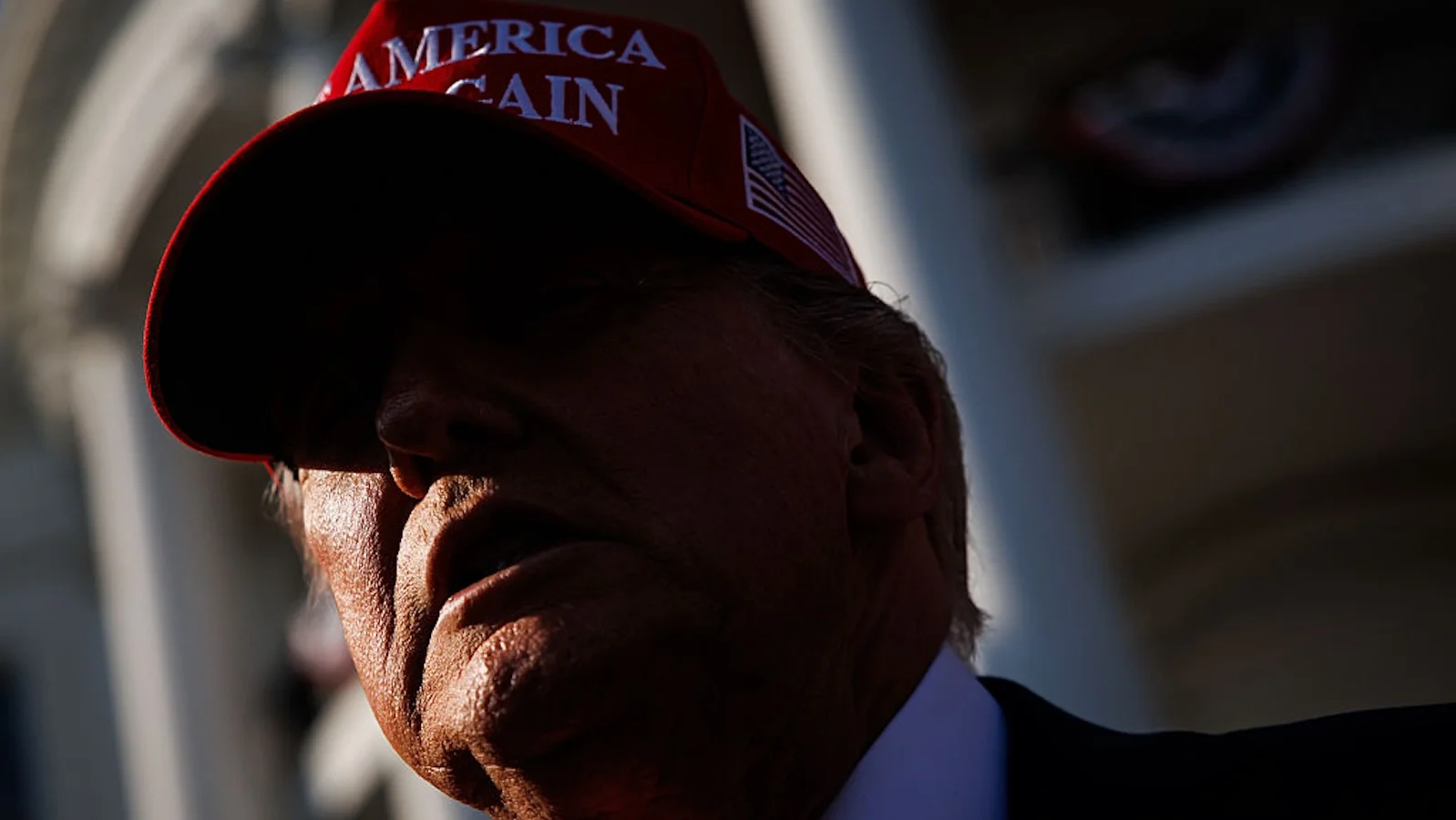 Close up of Donald Trump wearing a red Make America Great Again hat