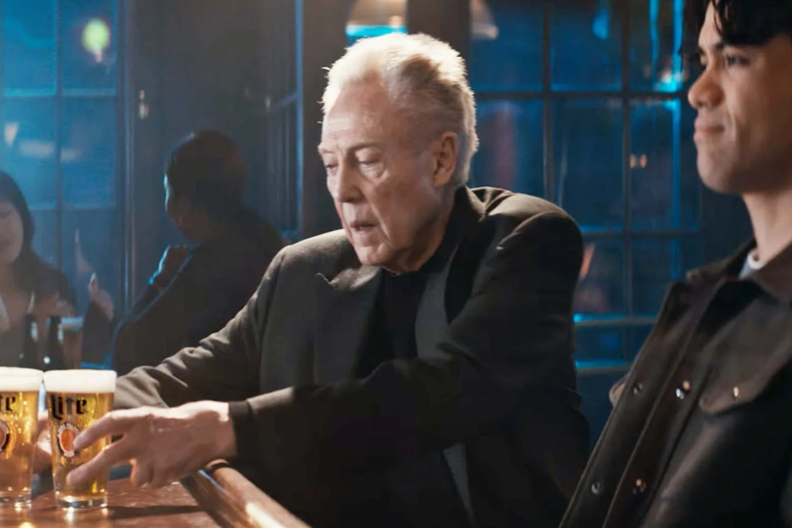 Christopher Walken sitting at the bar in the mentioned commercial. 