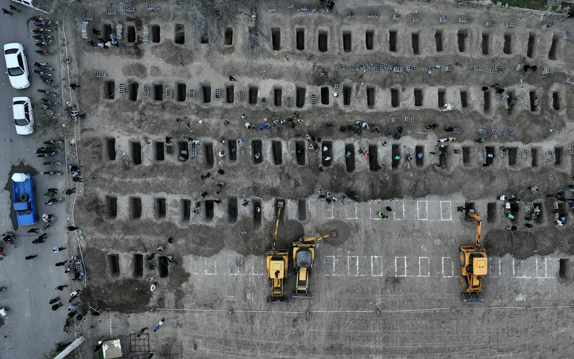 An aerial view of dozens of graves.