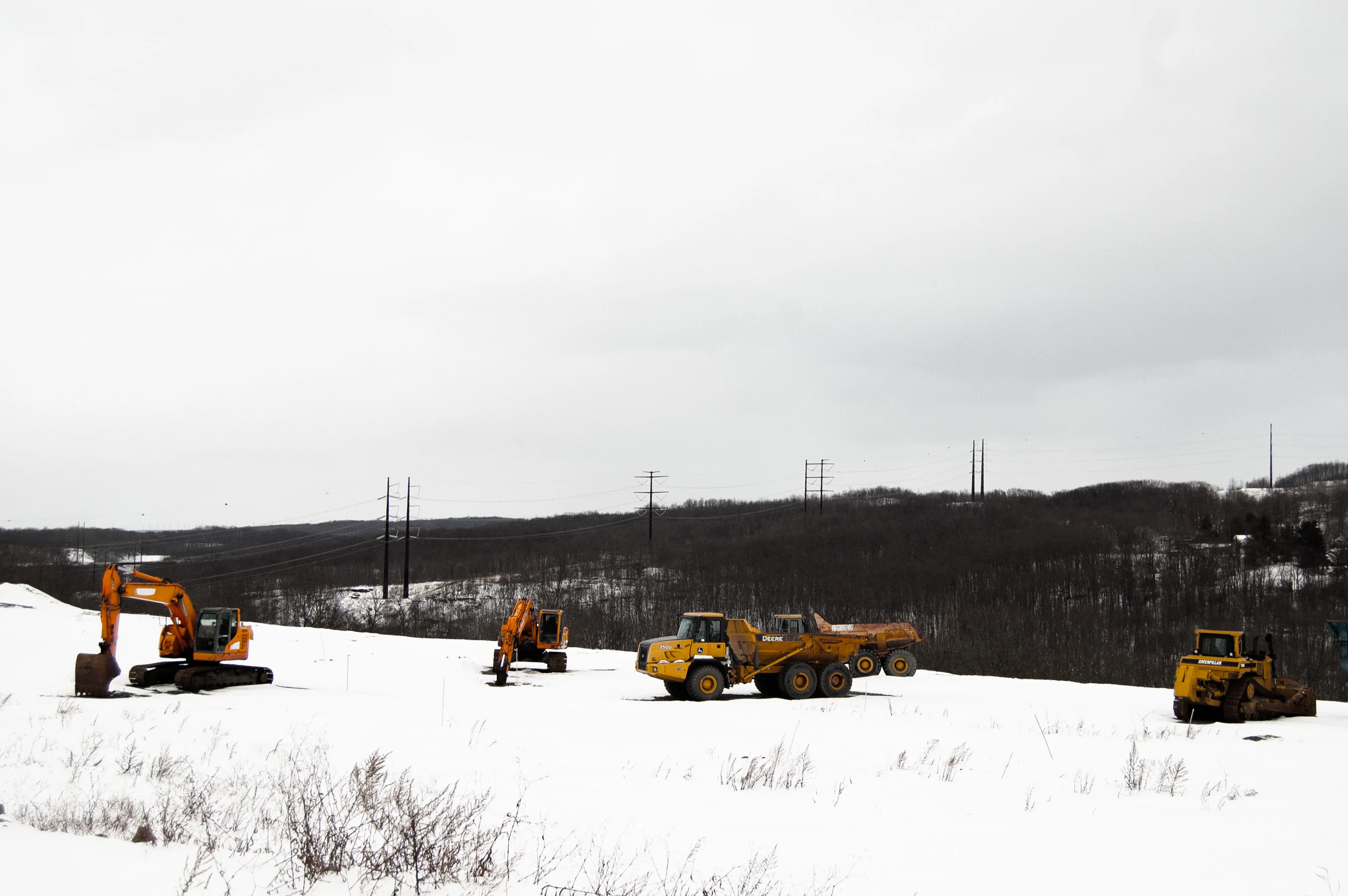 A high-voltage power line runs behind a construction site in Archbald, Pennsylvania.